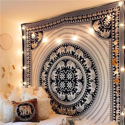 Beige tapestry with a large reddish-brown mandala pattern, hung above a bed in a bedroom. - Image 3