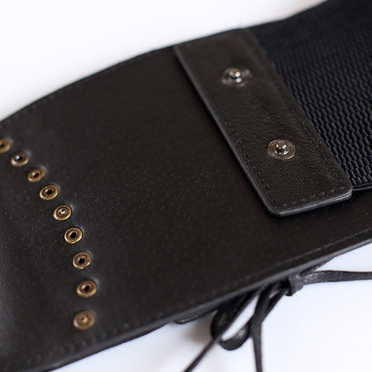 Red wide elastic belt with a faux leather lace-up front panel and bronze-tone eyelets, tied at the bottom. - Image 4