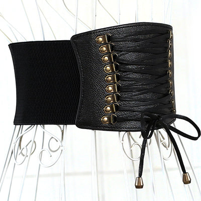 Red wide elastic belt with a faux leather lace-up front panel and bronze-tone eyelets, tied at the bottom. - Image 2