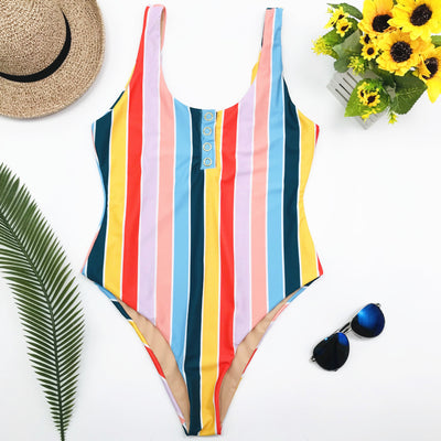 Colorful striped one-piece swimsuit with snap buttons, featuring pink, orange, yellow, green, and blue stripes. - Image 4