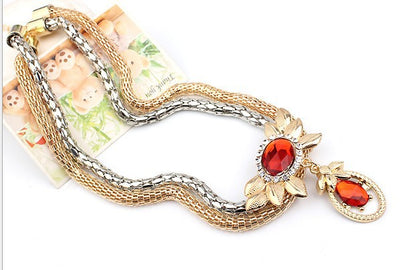 Bridal four-piece jewelry set with gold and silver-tone necklace, earrings, bracelet, and ring, featuring red crystal flowers. - Image 4