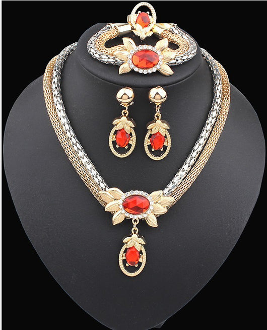 Bridal four-piece jewelry set with gold and silver-tone necklace, earrings, bracelet, and ring, featuring red crystal flowers. - Image 3