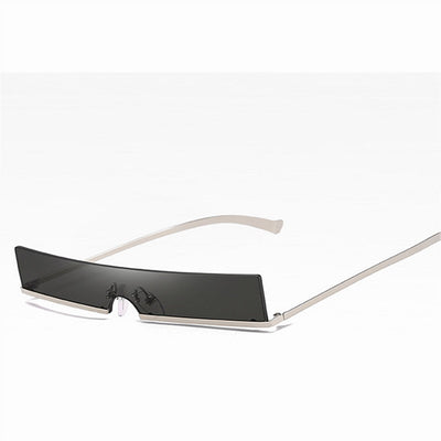 Frameless rectangular sunglasses with dark lenses and silver-colored metal temples, featuring an avant-garde style. - Image 8
