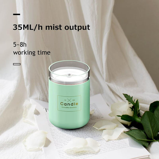 Light pink mini USB humidifier diffuser, shaped like a candle, with a clear top and visible mist output. - Image 8