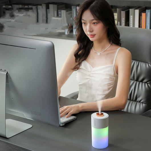 Pink and gradient colorful humidifier with a gold nozzle, featuring a night light function for air and room humidification.