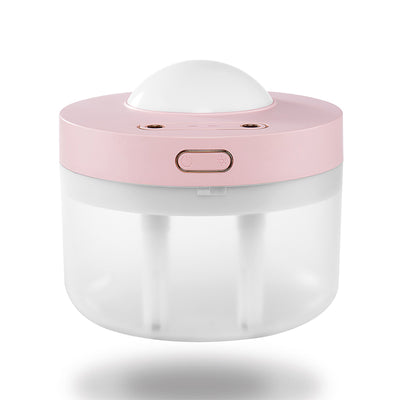 White portable projection humidifier with a translucent water tank and gold-accented control buttons. - Image 10