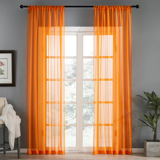 Sheer pink rod pocket curtain hanging on a black curtain rod, offering light transmission for a modern room. - Image 8