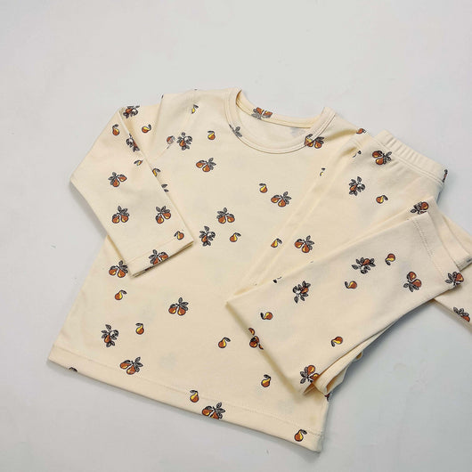 Light yellow infant long-sleeved pajama set with milk bottle and cookie print, suitable for homewear. - Image 24