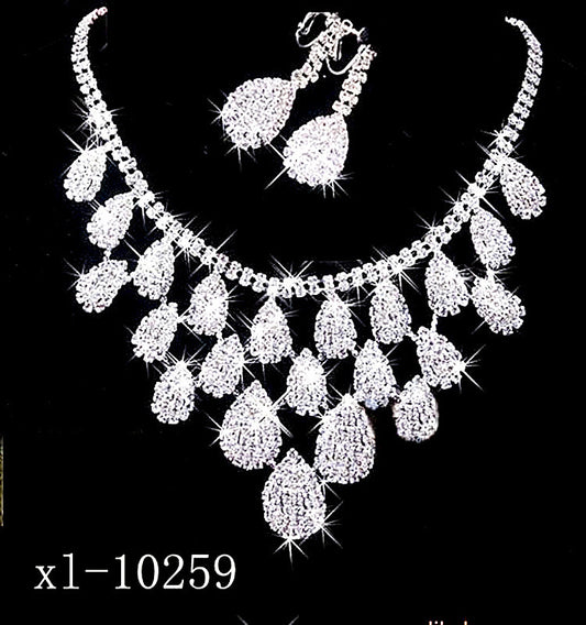 Sparkling silver-tone necklace with multiple teardrop-shaped rhinestone pendants, ideal for wedding or evening wear.