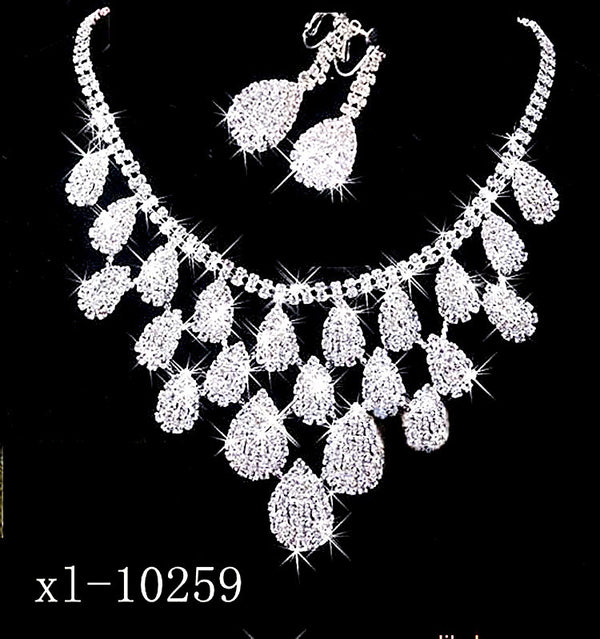 Sparkling silver-tone necklace with multiple teardrop-shaped rhinestone pendants, ideal for wedding or evening wear.