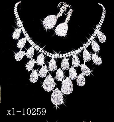 Sparkling silver-tone necklace with multiple teardrop-shaped rhinestone pendants, ideal for wedding or evening wear.
