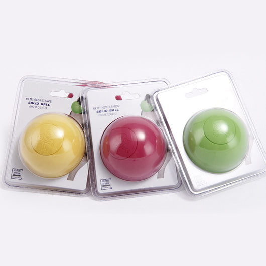 Red rubber elastic solid ball dog toy in clear blister packaging with images of dogs playing.