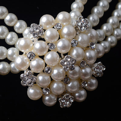 Luxury bridal pearl necklace and earring set with a multi-strand design and rhinestone flower accent. - Image 4