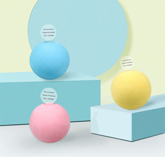 Pink pet gravity voice ball with a pull tab, packaged in a pink box with a cartoon bird design and musical notes. Includes a small bag of catnip.