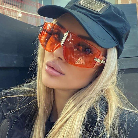 Black large square frame sunglasses with dark lenses and silver-tone accents on the temples and bridge.