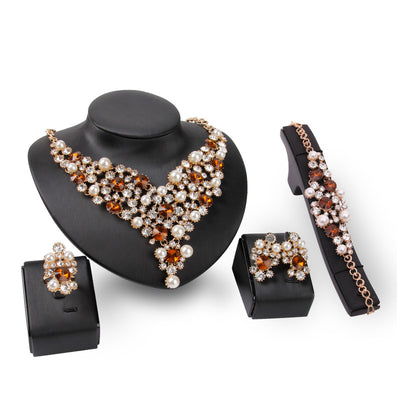 Four-piece bridal jewelry set with gold-toned necklace, earrings, bracelet, and ring, featuring amber and clear rhinestones with faux pearls. - Image 7