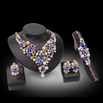 Four-piece bridal jewelry set with gold-toned necklace, earrings, bracelet, and ring, featuring amber and clear rhinestones with faux pearls. - Image 2