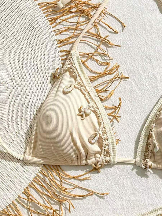 Light pink ribbed halterneck bikini with triangle cups and tie-side bottom, adorned with shell and starfish charms. - Image 14