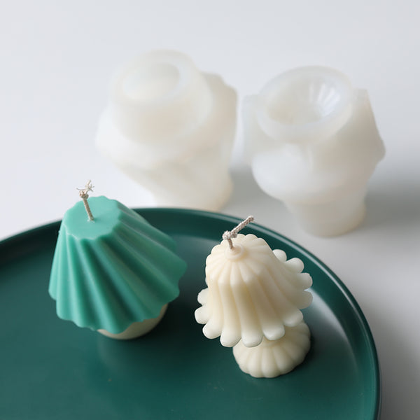 White silicone mold and a finished cream-colored lampstand-shaped candle with a wick, measuring 6.7cm tall.