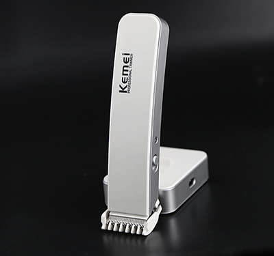 White and silver Kemei Professional Trimmer electric hair clipper with charging base. - Image 7
