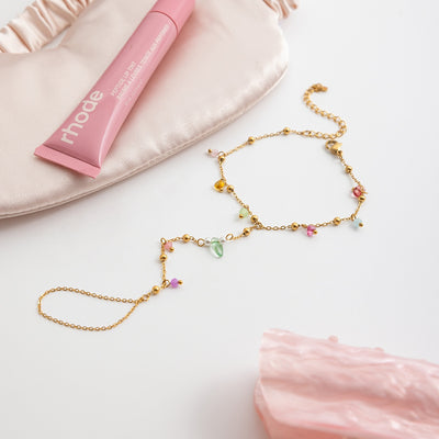 Gold-colored bracelet with a chain of small, interconnected heart-shaped links, featuring a lobster clasp and extender. - Image 17
