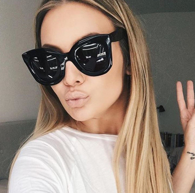 Transparent pink cat-eye sunglasses with gradient gray lenses, featuring a thick frame and vintage style. - Image 2