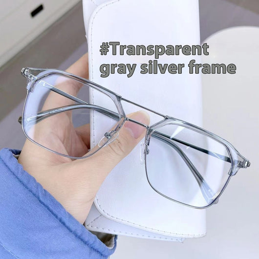 Anti-blue light glasses with a sand black and silver double beam frame, held against a white case. - Image 14