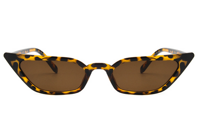 Narrow cat-eye sunglasses with a transparent yellow frame and yellow tinted lenses on a white background. - Image 5