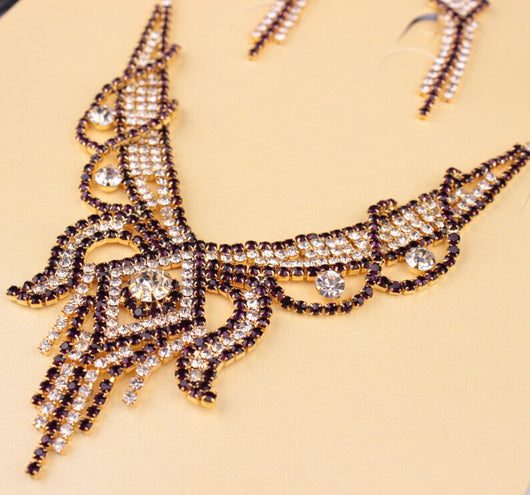 Gold-toned exaggerated butterfly necklace and matching drop earrings set, adorned with clear and champagne rhinestones. - Image 6