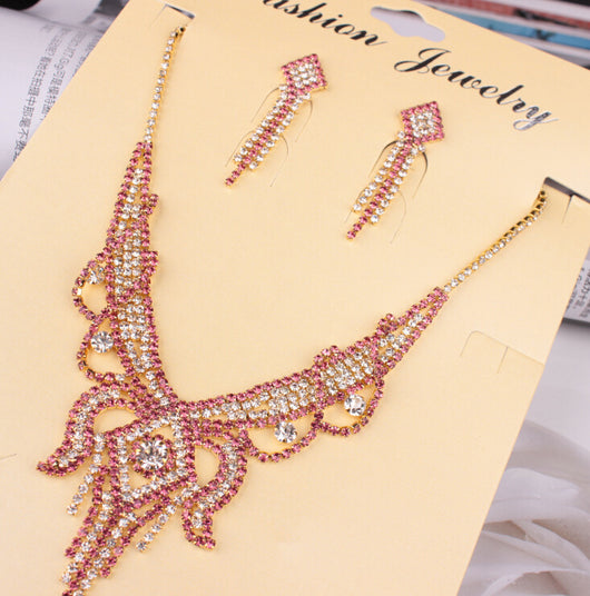 Gold-toned exaggerated butterfly necklace and matching drop earrings set, adorned with clear and champagne rhinestones. - Image 10