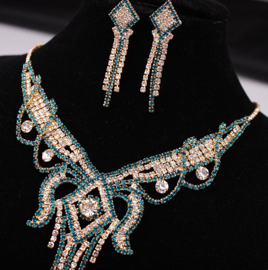 Gold-toned exaggerated butterfly necklace and matching drop earrings set, adorned with clear and champagne rhinestones. - Image 5