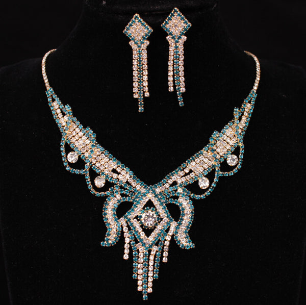 Gold-toned exaggerated butterfly necklace and matching drop earrings set, adorned with clear and champagne rhinestones.