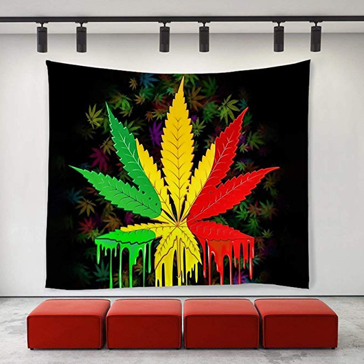Black tapestry with a large, vibrant green, yellow, and red cannabis leaf design featuring a dripping paint effect.
