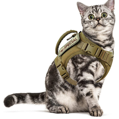 Black tactical pet harness made of Oxford cloth with an American flag patch, top handle, and quick-release buckles.