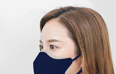 Peach disposable 3-layer face mask with perforated details worn by a person, offering comfortable daily protection. - Image 5