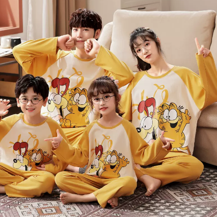 Family of four wearing matching yellow long-sleeved cotton pajamas with a cute panda design and "HUG ME!" text. - Image 9
