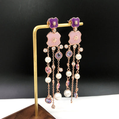 Aretes Estrella de Ocho Puntas Dorados con Diamantes y Borla de Perla - Image 3