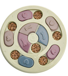 Paw-shaped dog puzzle feeder toy in light yellow with colorful sliding covers, filled with kibble. - Image 20
