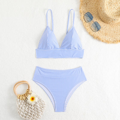 Green and white striped two-piece bikini with a triangle top and high-waisted bottoms on a woman. - Image 12