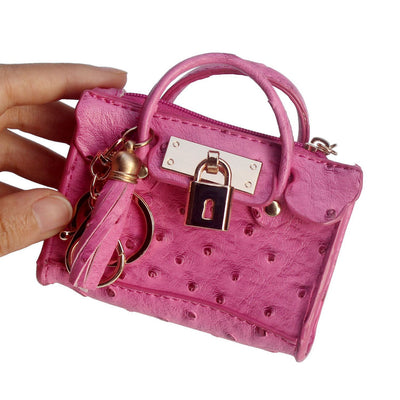 Bolso de Mano Minimalista en Cuero con Borlas - Image 12