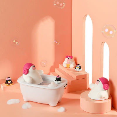 Creative air humidifier shaped like a white bathtub with a polar bear wearing pink earmuffs and a small penguin.