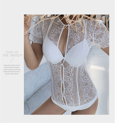 White lace cut-out one-piece swimsuit with short sleeves and a deep V-neckline, modeled by a woman. - Image 13