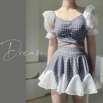 Women's conservative two-piece swimsuit with beige and white houndstooth pattern, sheer puff sleeves, and a flared skirt. - Image 2