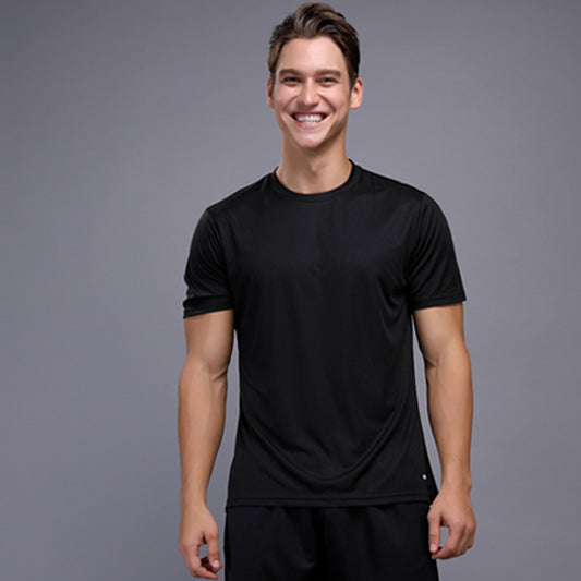 Smiling man wearing a black short sleeve crew neck t-shirt, ideal for sports and fitness activities.