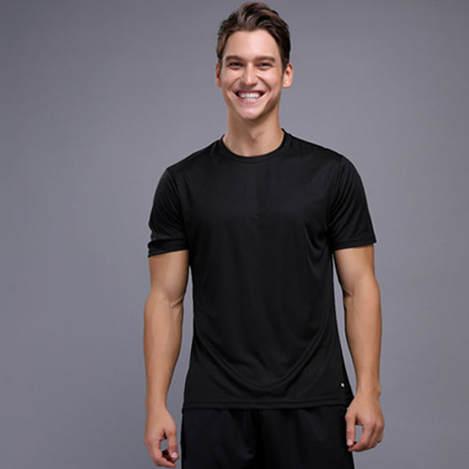 Smiling man wearing a black short sleeve crew neck t-shirt, ideal for sports and fitness activities.