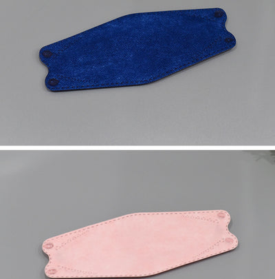 A fan of multi-colored KF94 fish-shaped masks in pink, blue, teal, white, gold, black, and grey, next to a packaged mask. - Image 14