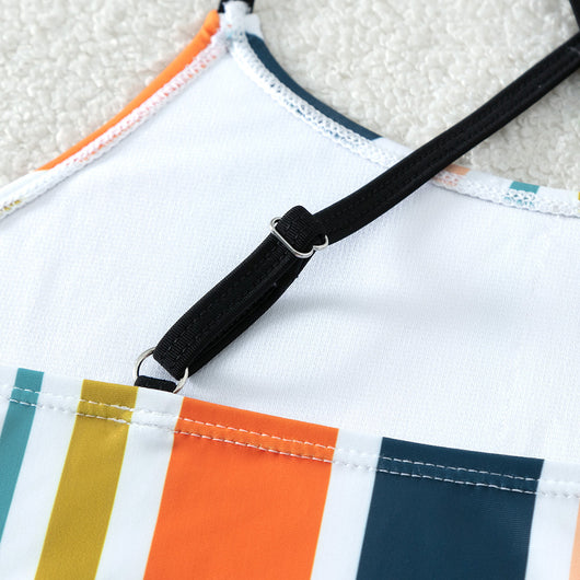 Girls' two-piece bikini swimsuit with a colorful striped crop top and solid black high-waisted ruched bottoms. - Image 3