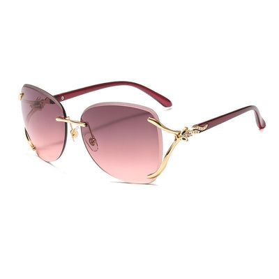 Oversized rimless sunglasses with gradient gray lenses and silver-tone metal accents, displayed on a white surface. - Image 10