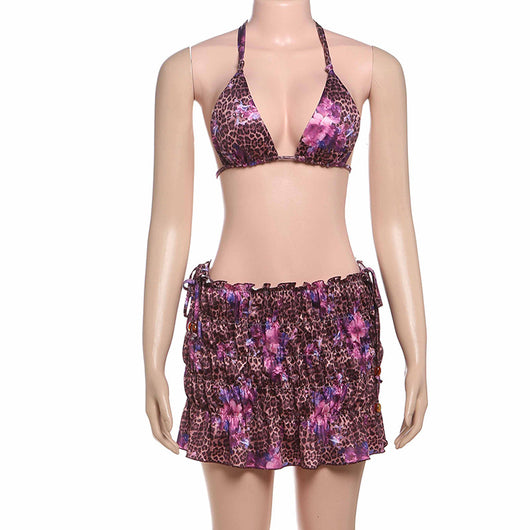 Three-piece bikini set with a brown leopard and pink floral print halter top, matching bottom, and ruched mini skirt. - Image 24