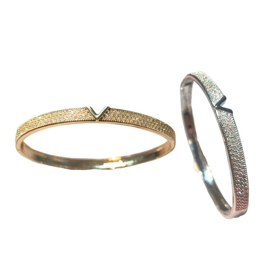 V-shaped 18K gold electroplated bracelet and ring set with pave clear stones on a white stand. - Image 5